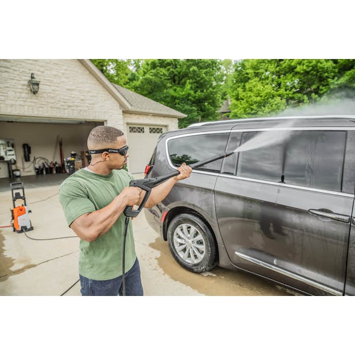 Man washing van with the STIHL® RE 110 PLUS power washer